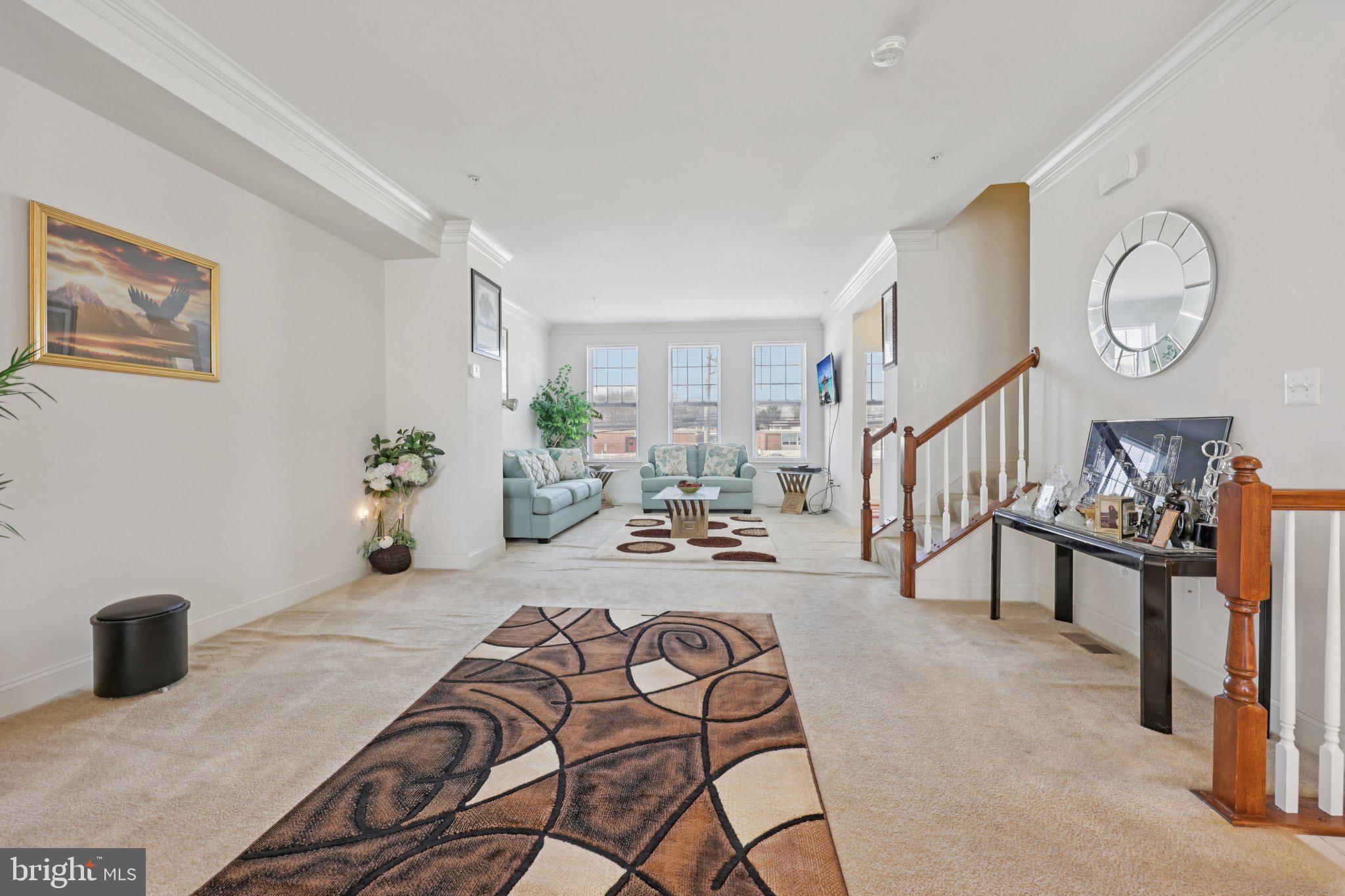 7206 Wood Meadow Way Lanham, MD 20706 - Photo 17 of 61 a view of a livingroom with furniture and a window