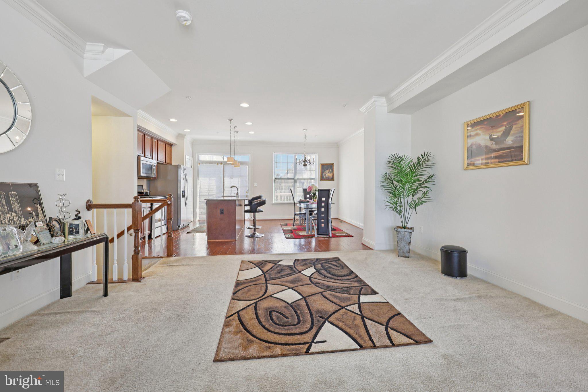 7206 Wood Meadow Way Lanham, MD 20706 - Photo 19 of 61 a living room with furniture and a potted plant