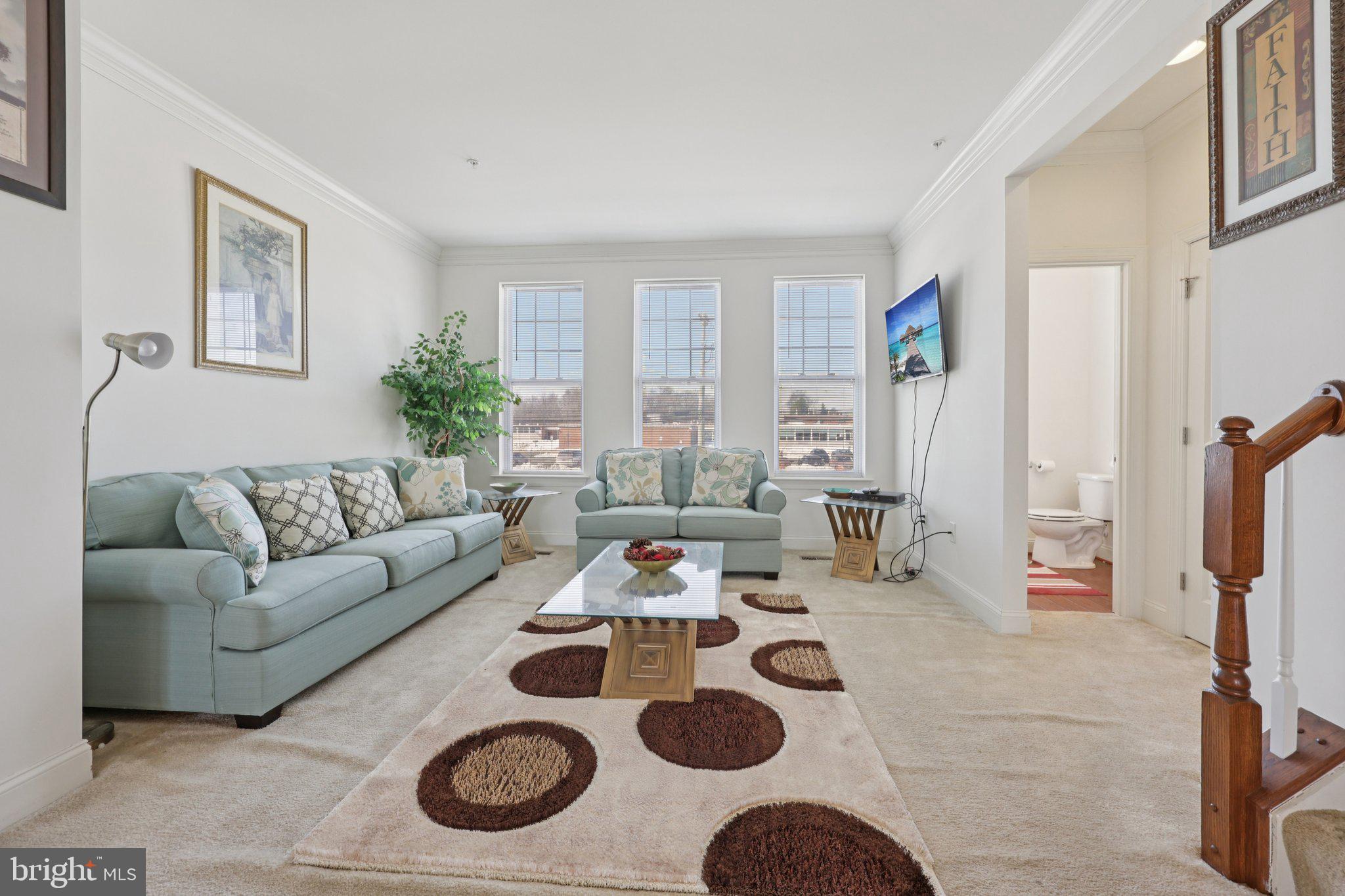 7206 Wood Meadow Way Lanham, MD 20706 - Photo 22 of 61 a living room with furniture and a window