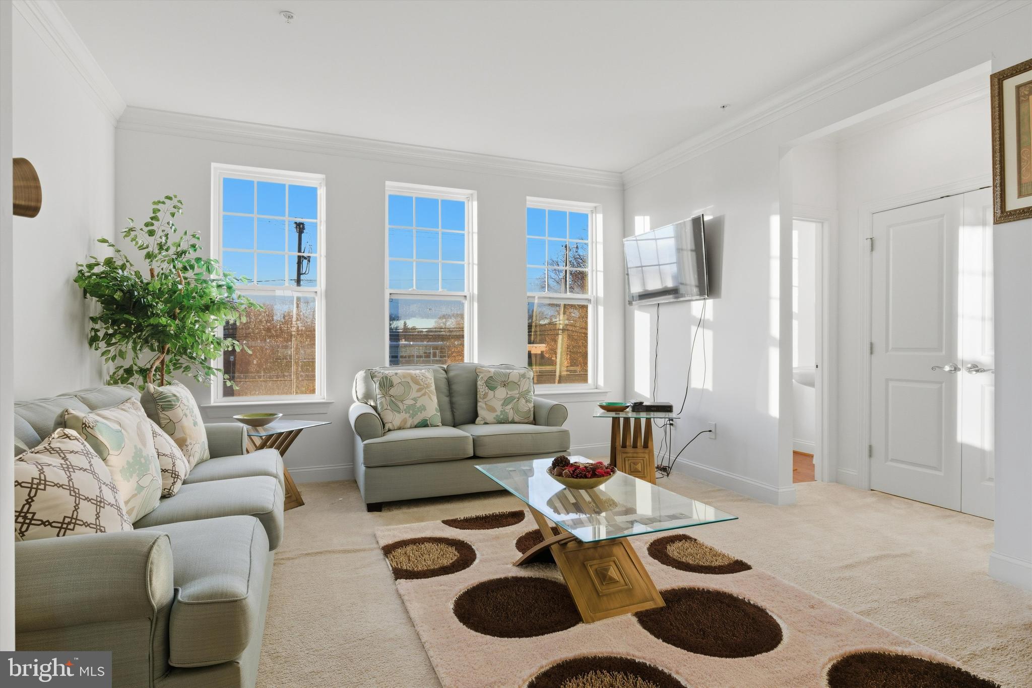 7206 Wood Meadow Way Lanham, MD 20706 - Photo 23 of 61 a living room with furniture and a large window