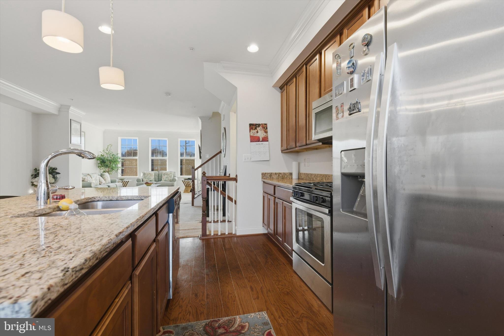 7206 Wood Meadow Way Lanham, MD 20706 - Photo 34 of 61 a kitchen with stainless steel appliances granite countertop a sink and stove