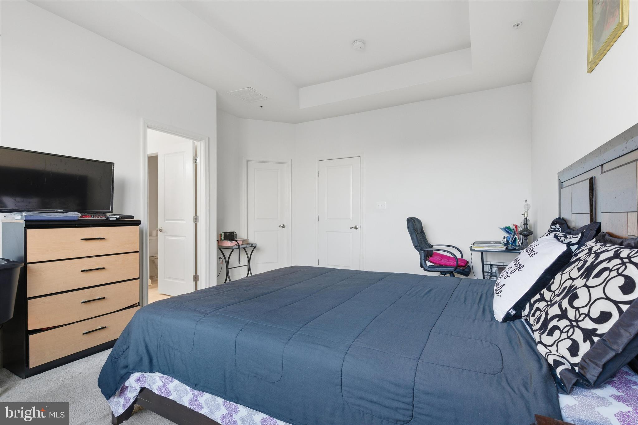 7206 Wood Meadow Way Lanham, MD 20706 - Photo 37 of 61 a bedroom with a bed and flat screen tv