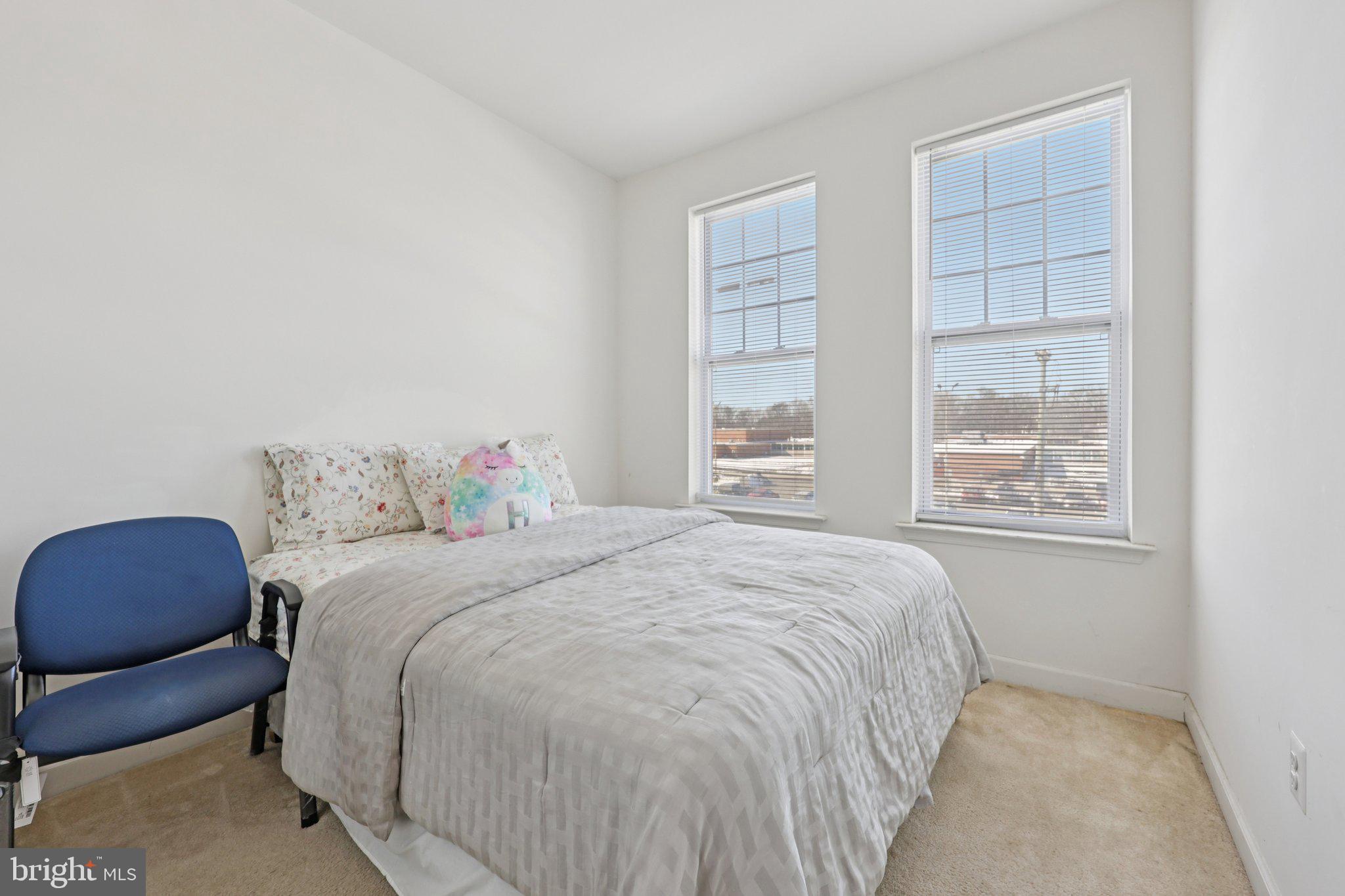 7206 Wood Meadow Way Lanham, MD 20706 - Photo 49 of 61 a bedroom with a bed chair and window