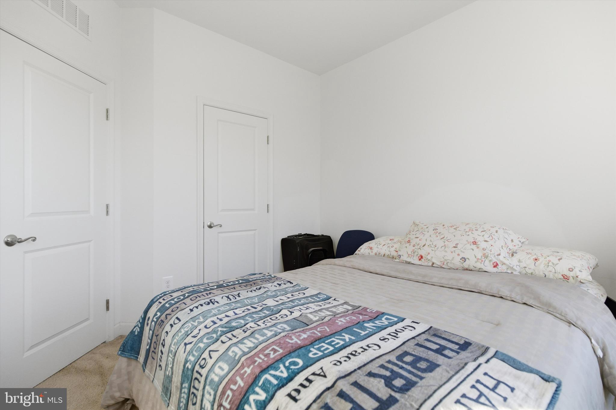 7206 Wood Meadow Way Lanham, MD 20706 - Photo 52 of 61 a bedroom with a bed and a window