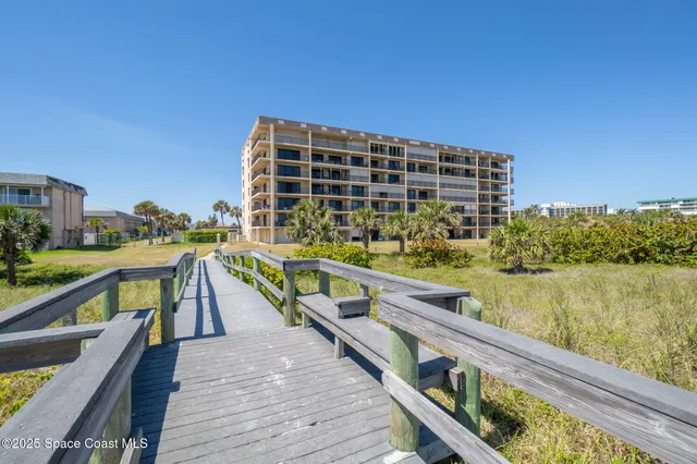 a view of lawn chairs and table in patio