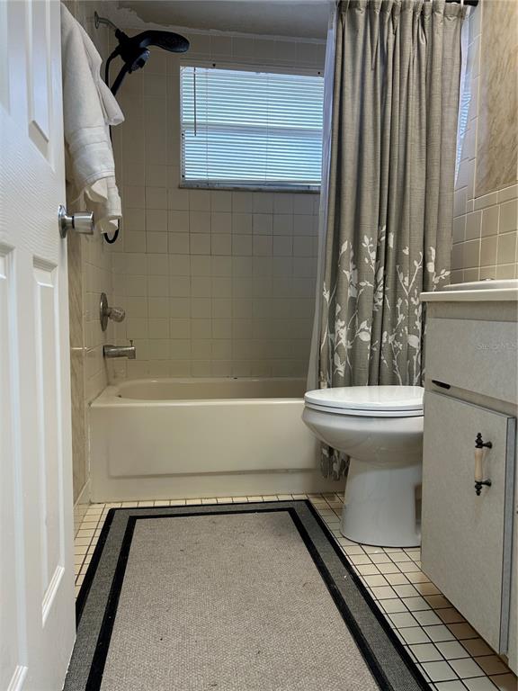 7808 Osteen Road New Port Richey, FL 34653 - Photo 13 of 20 a bathroom with a sink toilet and shower