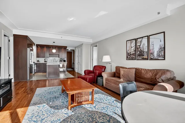 a living room with furniture and a table