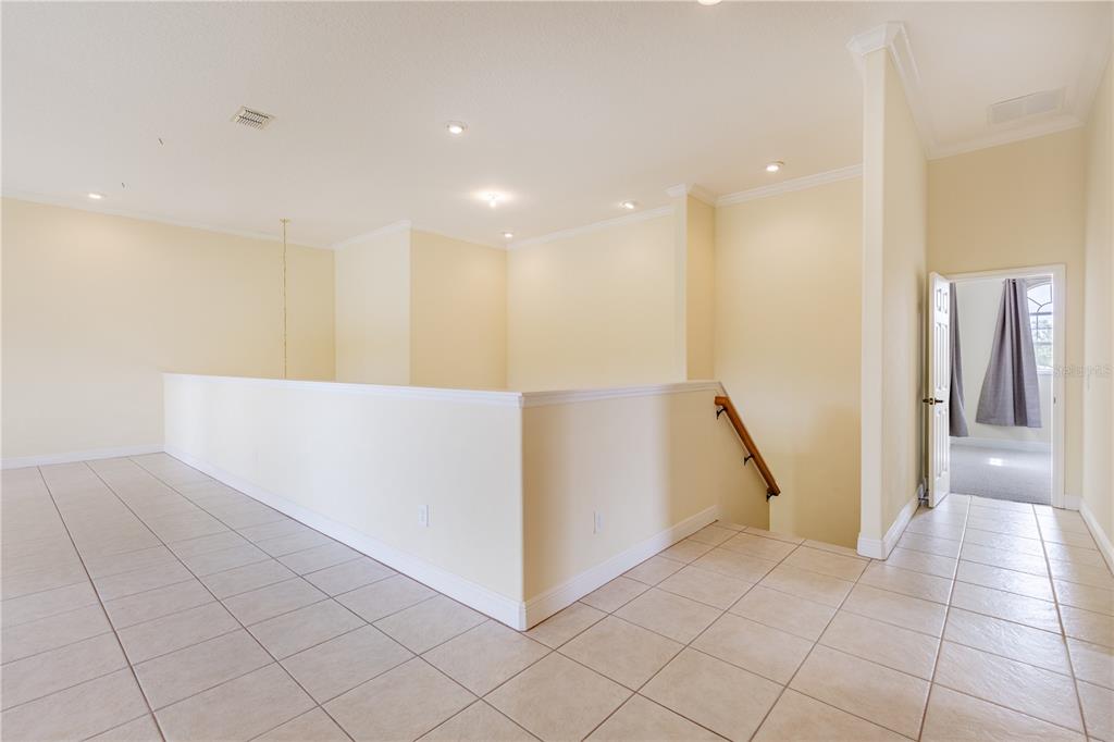 2718 Knightsbridge Road Clermont, FL 34711 - Photo 28 of 72 a view of a hallway with staircase