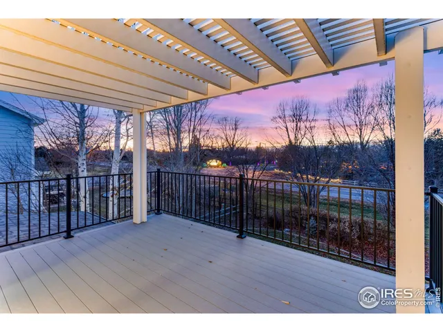 a view of a balcony with wooden floor