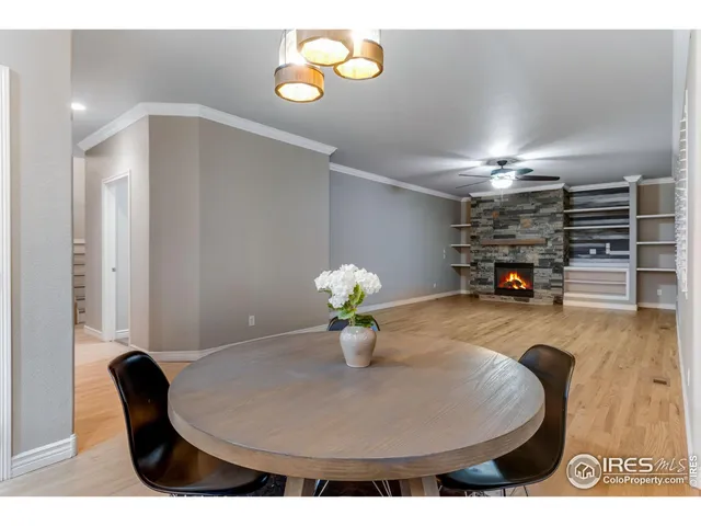 a dining room with furniture and a chandelier