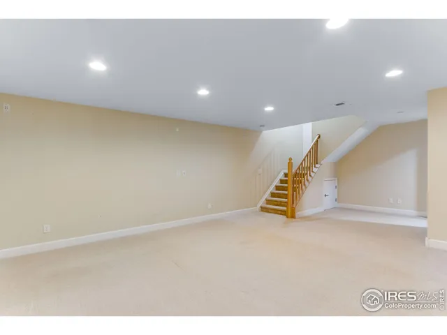 a view of an empty room with stairs
