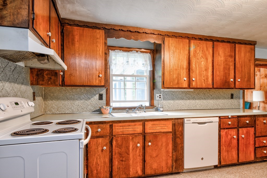 186 Edmands Road Framingham, MA 01701 - Photo 11 of 26 a kitchen with stainless steel appliances granite countertop a sink a stove and a refrigerator