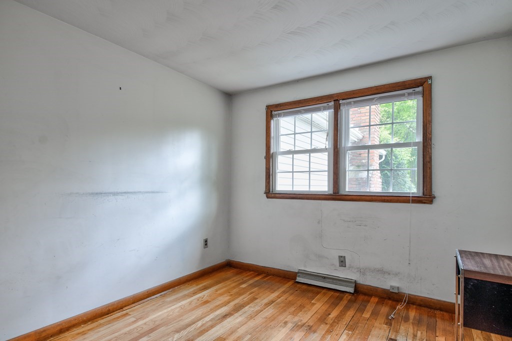 186 Edmands Road Framingham, MA 01701 - Photo 16 of 26 a view of a room with wooden floor and cabinet