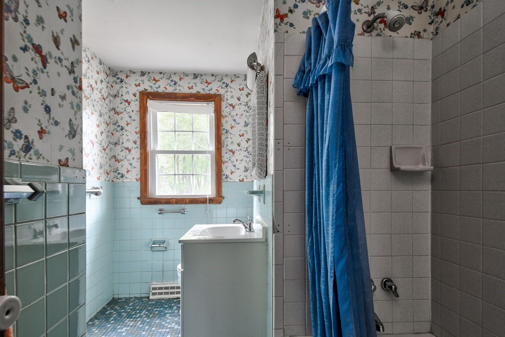 186 Edmands Road Framingham, MA 01701 - Photo 17 of 26 a bathroom with a bathtub and shower