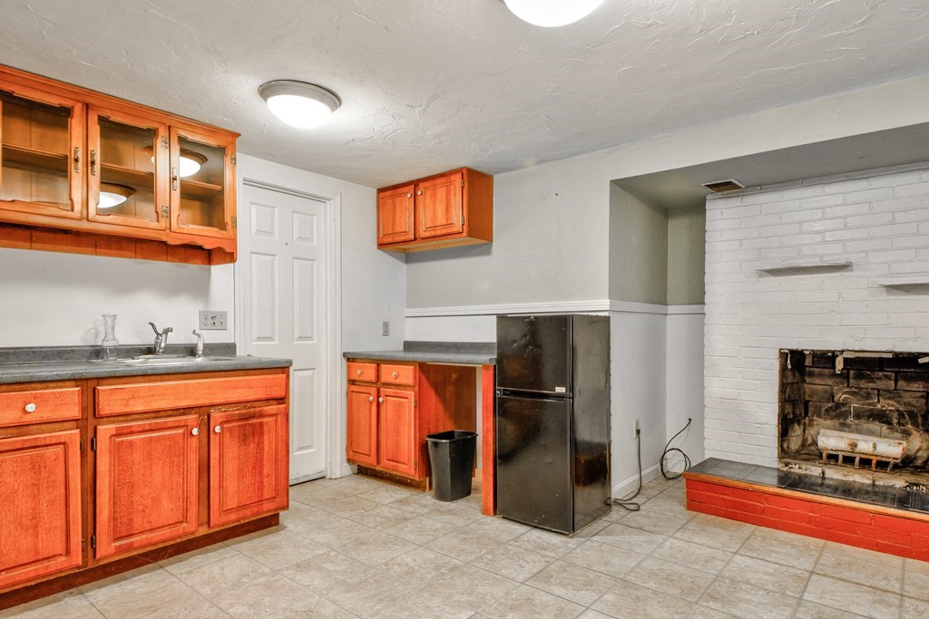 186 Edmands Road Framingham, MA 01701 - Photo 24 of 26 a kitchen with stainless steel appliances granite countertop a refrigerator and a sink