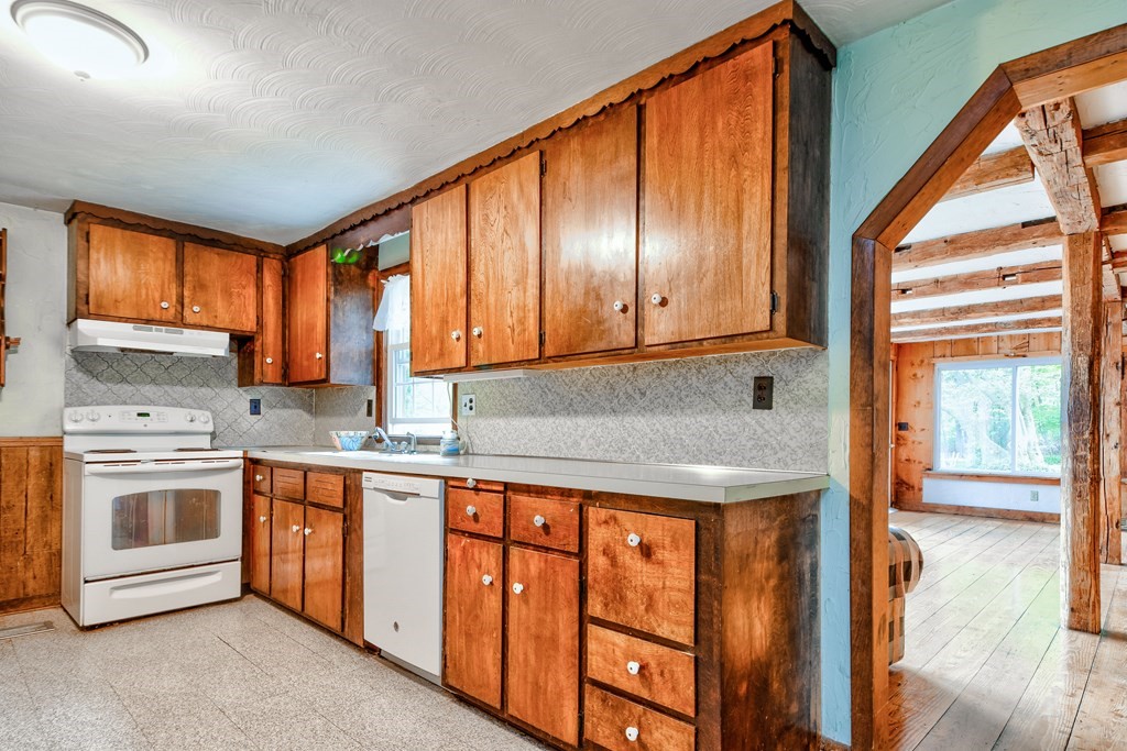 186 Edmands Road Framingham, MA 01701 - Photo 8 of 26 a kitchen with stainless steel appliances granite countertop a stove a sink and a microwave