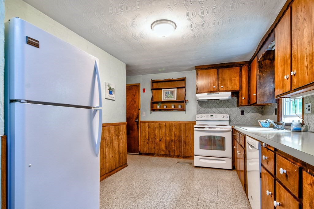 186 Edmands Road Framingham, MA 01701 - Photo 9 of 26 a kitchen with stainless steel appliances granite countertop a refrigerator a stove a sink and a window
