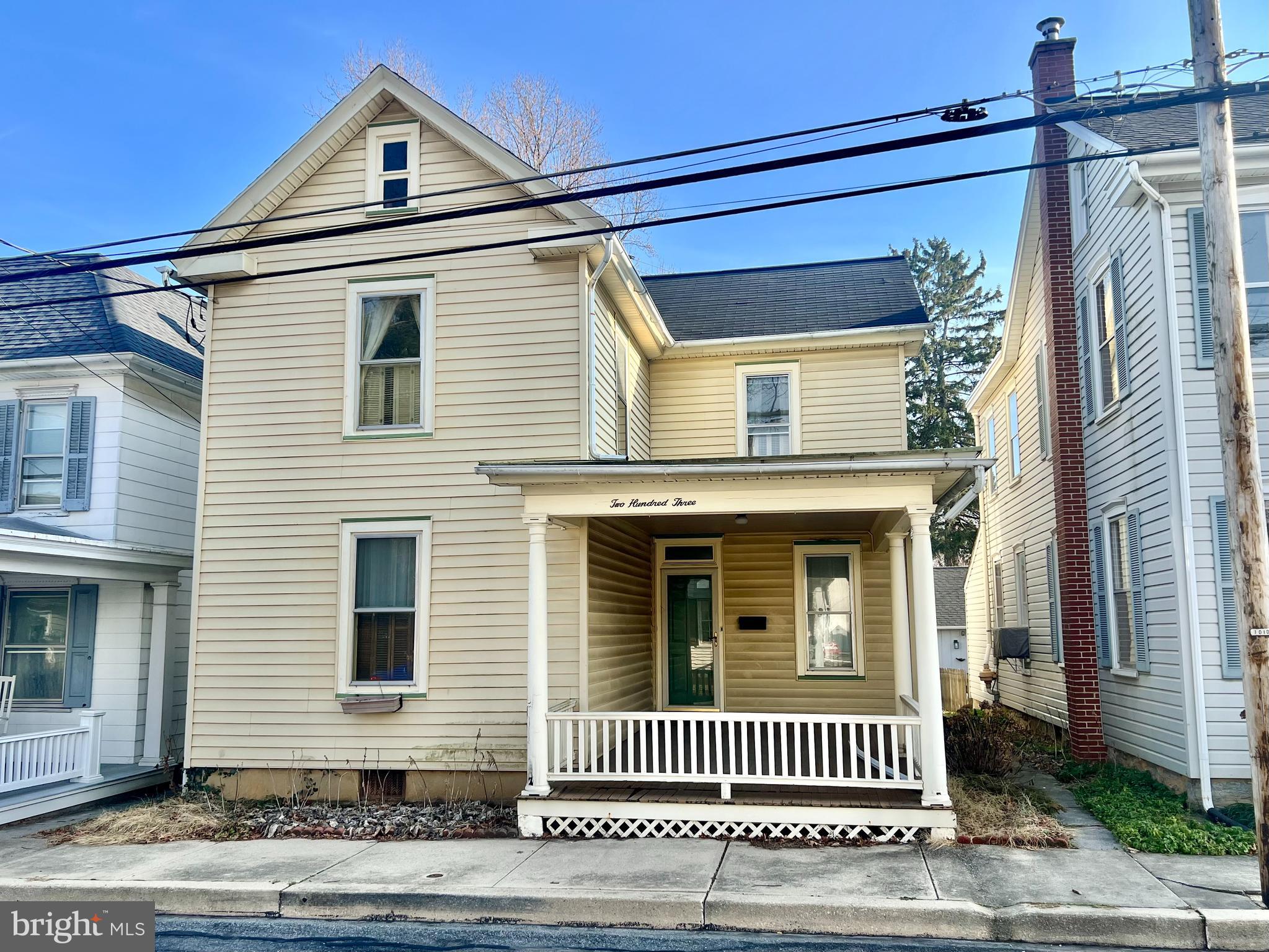 a view of a house with a door and wooden floor