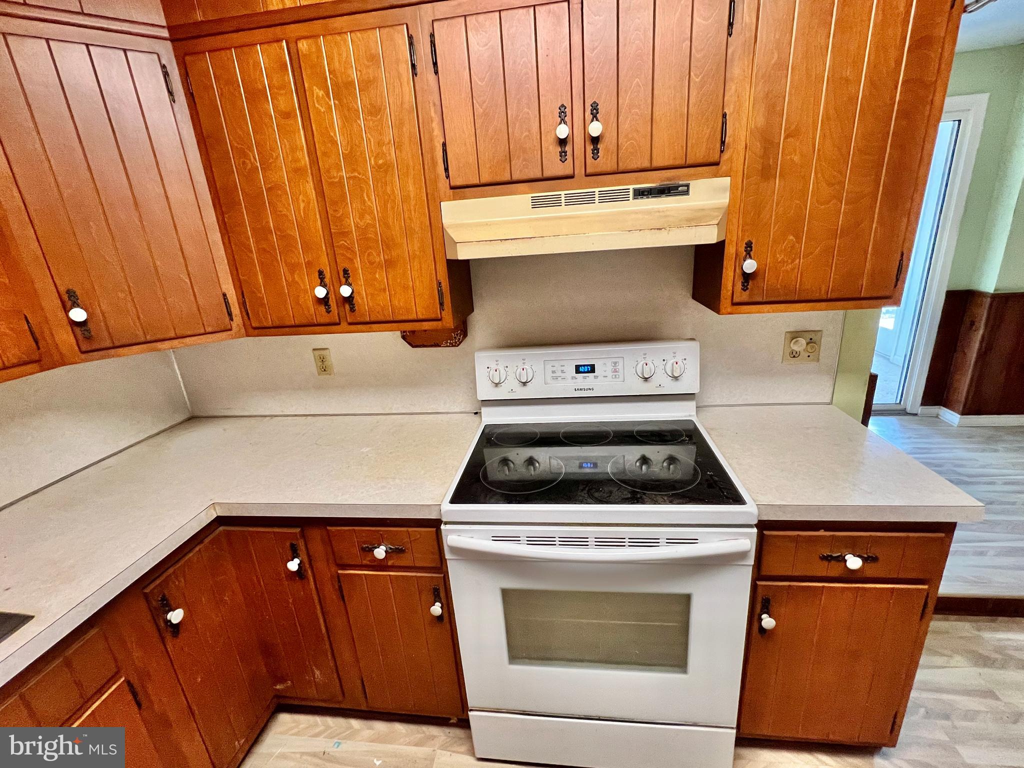 203 North Cedar Street Lititz, PA 17543 - Photo 11 of 34 a kitchen with wooden cabinets and a stove top oven