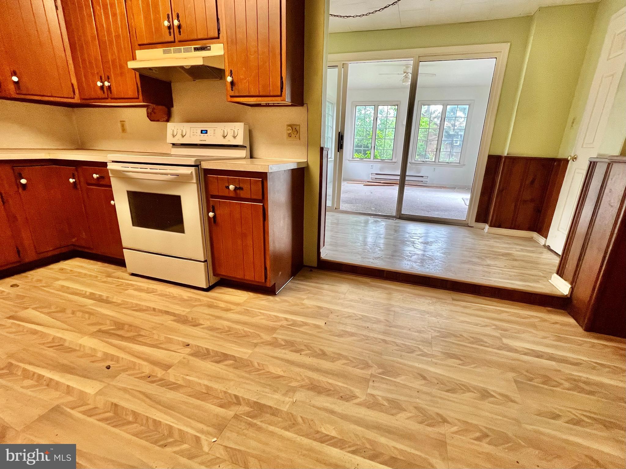 203 North Cedar Street Lititz, PA 17543 - Photo 12 of 34 a kitchen with stainless steel appliances granite countertop a stove a sink and a microwave