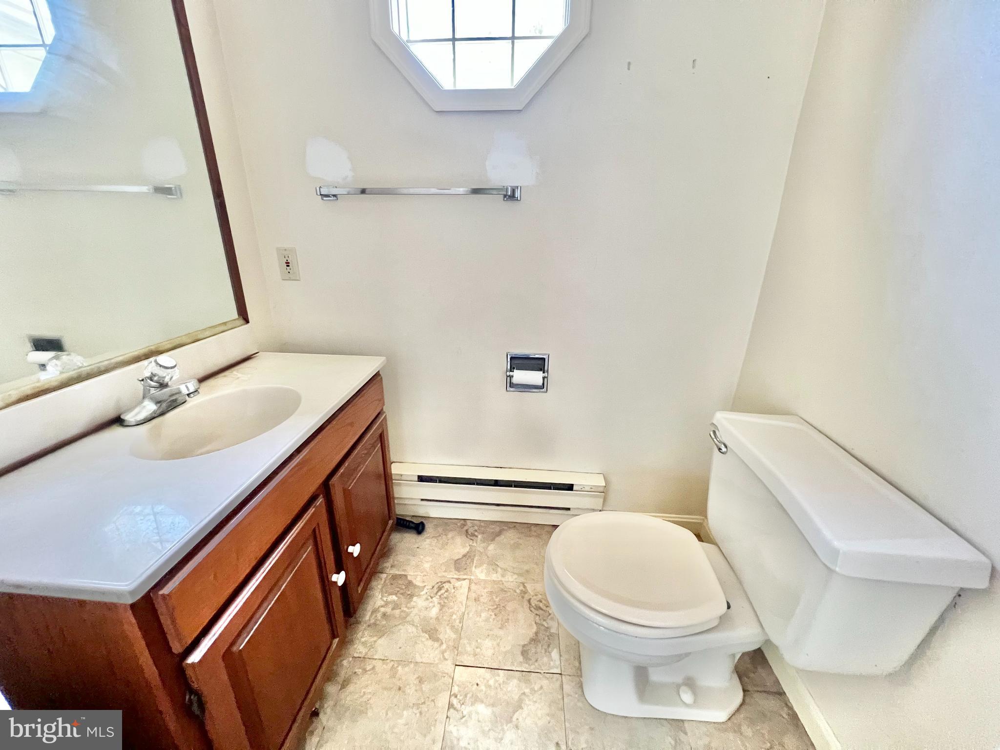 203 North Cedar Street Lititz, PA 17543 - Photo 17 of 34 a bathroom with a sink a toilet and a mirror