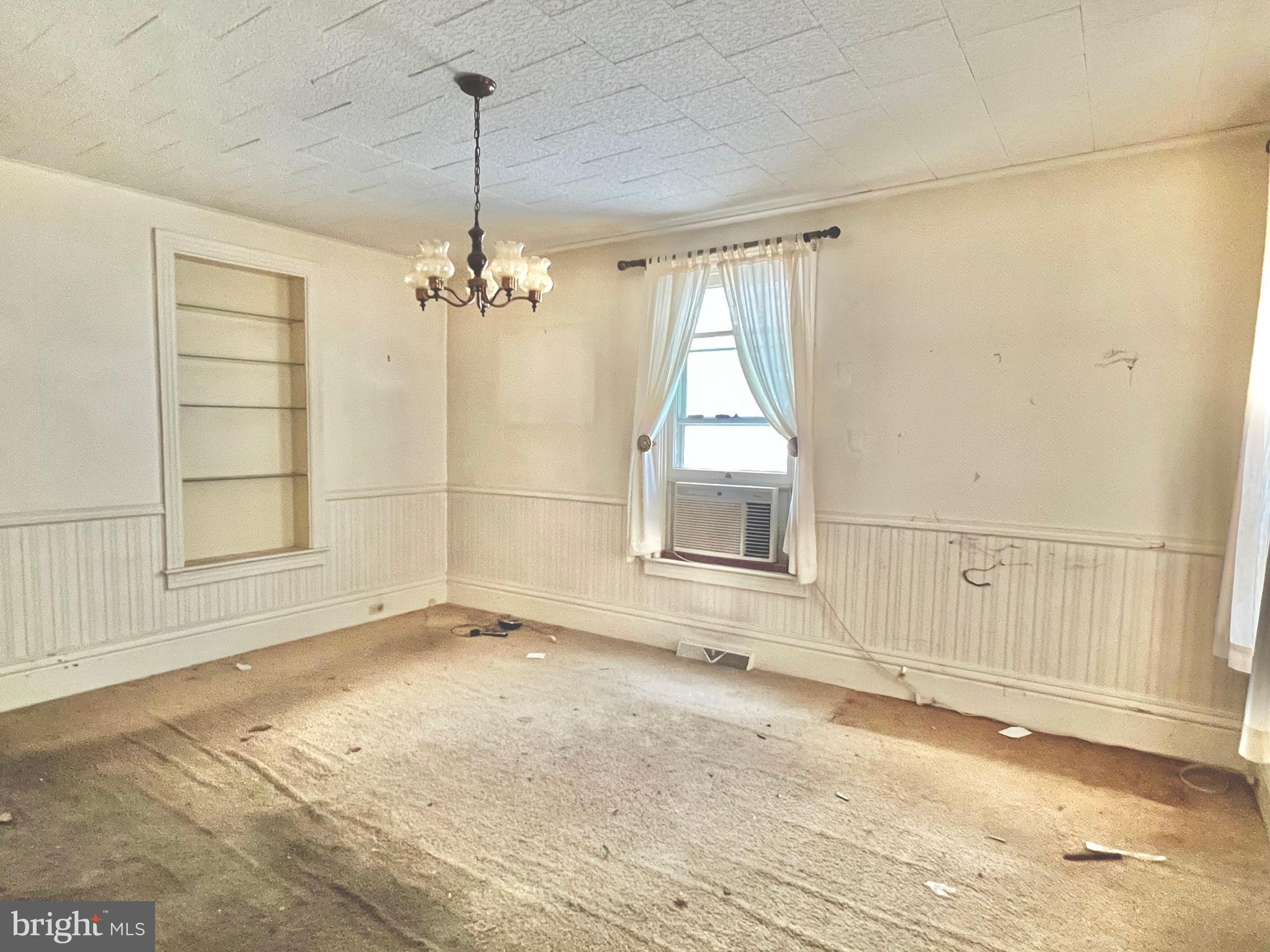 203 North Cedar Street Lititz, PA 17543 - Photo 2 of 34 an empty room with a windows and chandelier