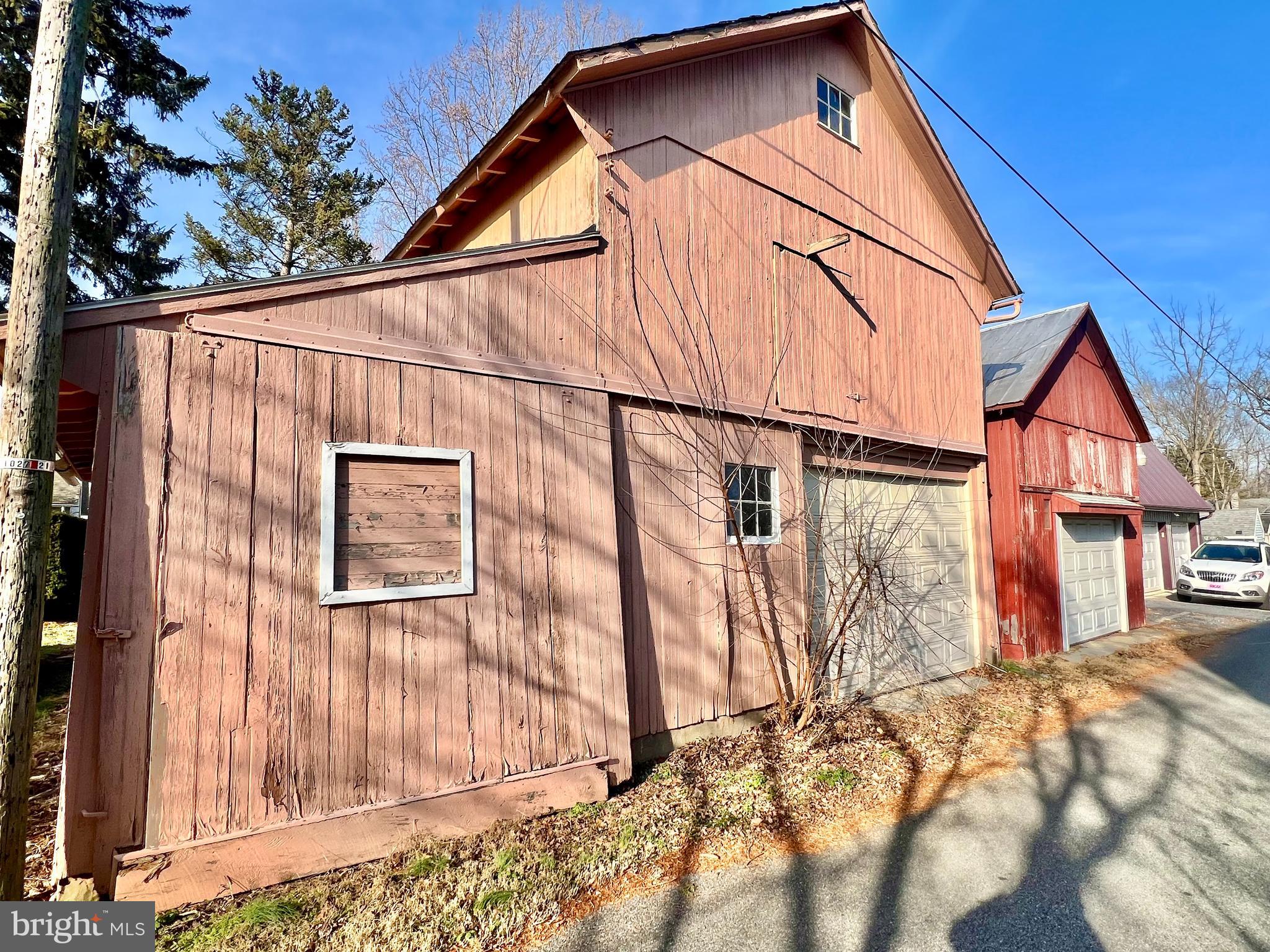 203 North Cedar Street Lititz, PA 17543 - Photo 33 of 34 a backyard of a house with wooden fence and large windows