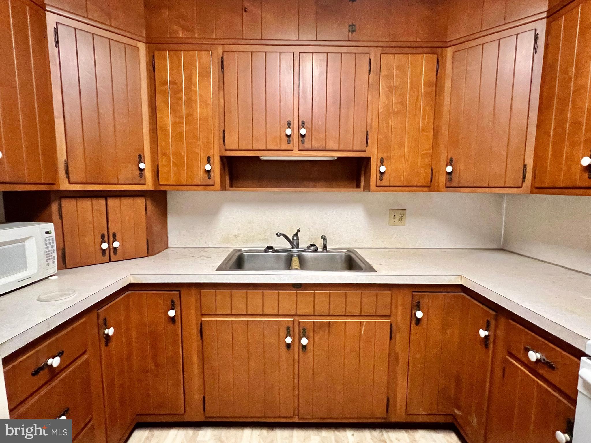 203 North Cedar Street Lititz, PA 17543 - Photo 9 of 34 a kitchen with a sink a window and cabinets