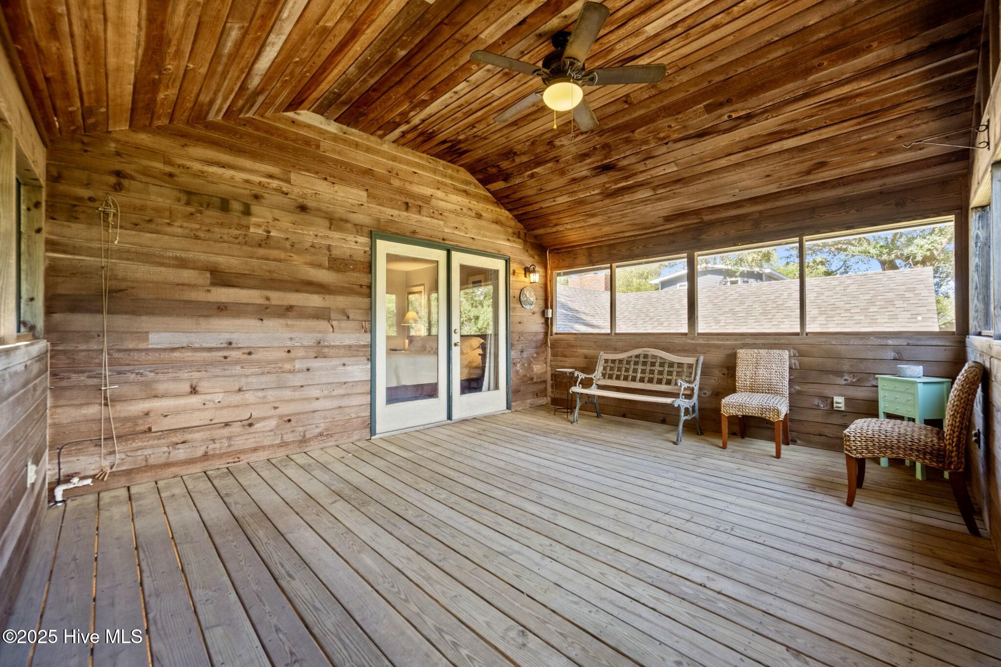 802 Sound View Drive Hampstead, NC 28443 - Photo 31 of 66 Screened in porch off of primary bedroom