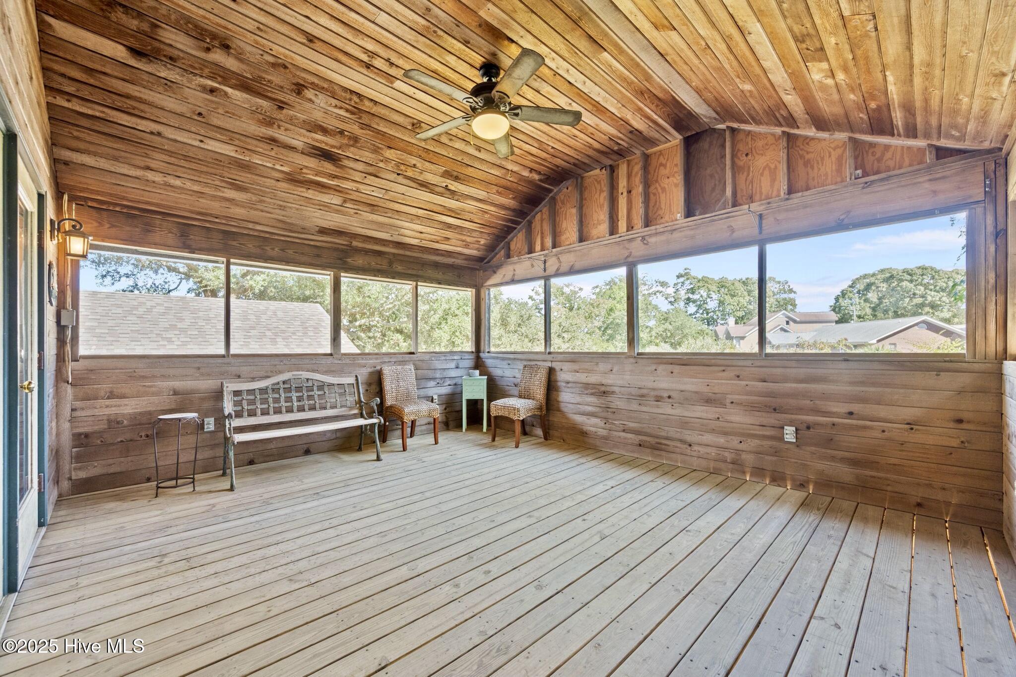 802 Sound View Drive Hampstead, NC 28443 - Photo 32 of 66 Screened in porch off of primary bedroom