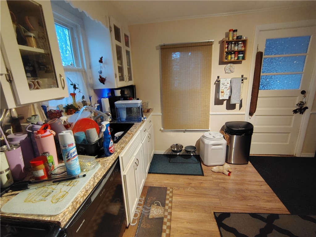 16 Whalin Street Rochester, NY 14620 - Photo 35 of 38 Kitchen south wall - window and kitchen door