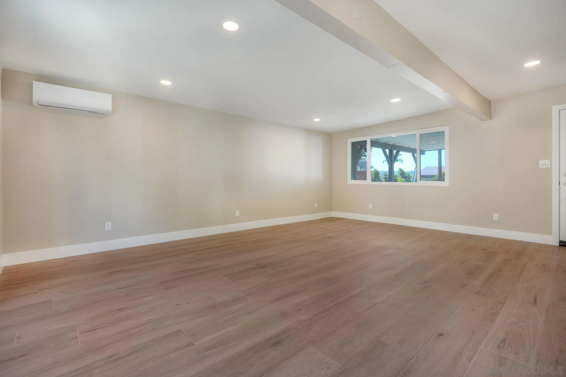 578 East Indian Rock Road Vista, CA 92084 - Photo 6 of 30 an empty room with wooden floor and windows