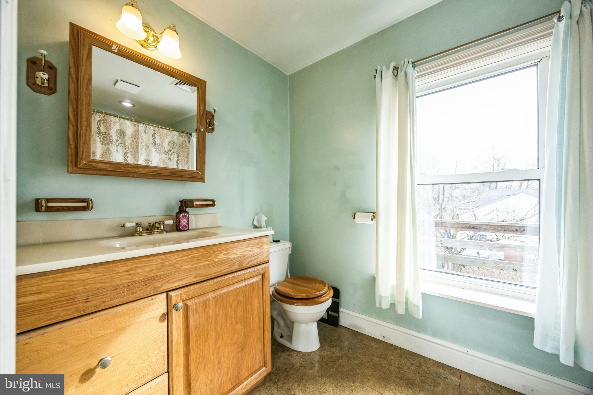 21 Hartford Road Mount Laurel, NJ 08054 - Photo 17 of 26 a bathroom with a toilet a sink and a mirror