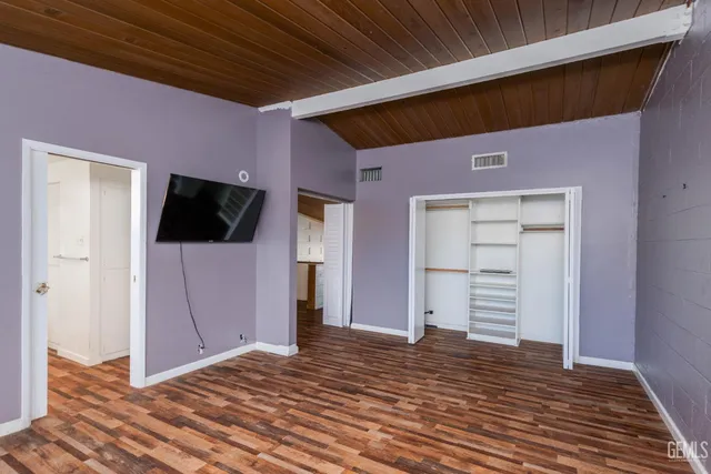 a view of a livingroom with wooden floor