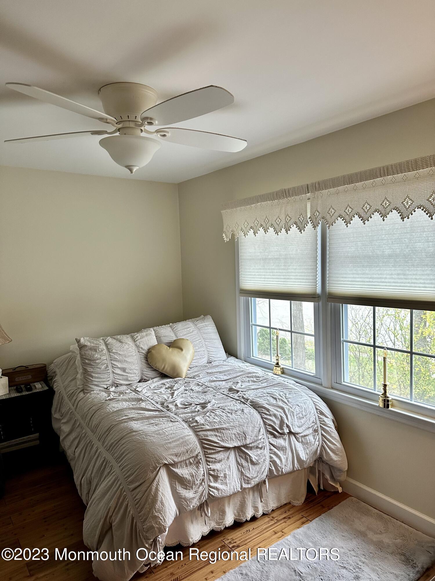 12 Spicy Pond Road Howell, NJ 07731 - Photo 13 of 19 a bedroom with a large bed and a window