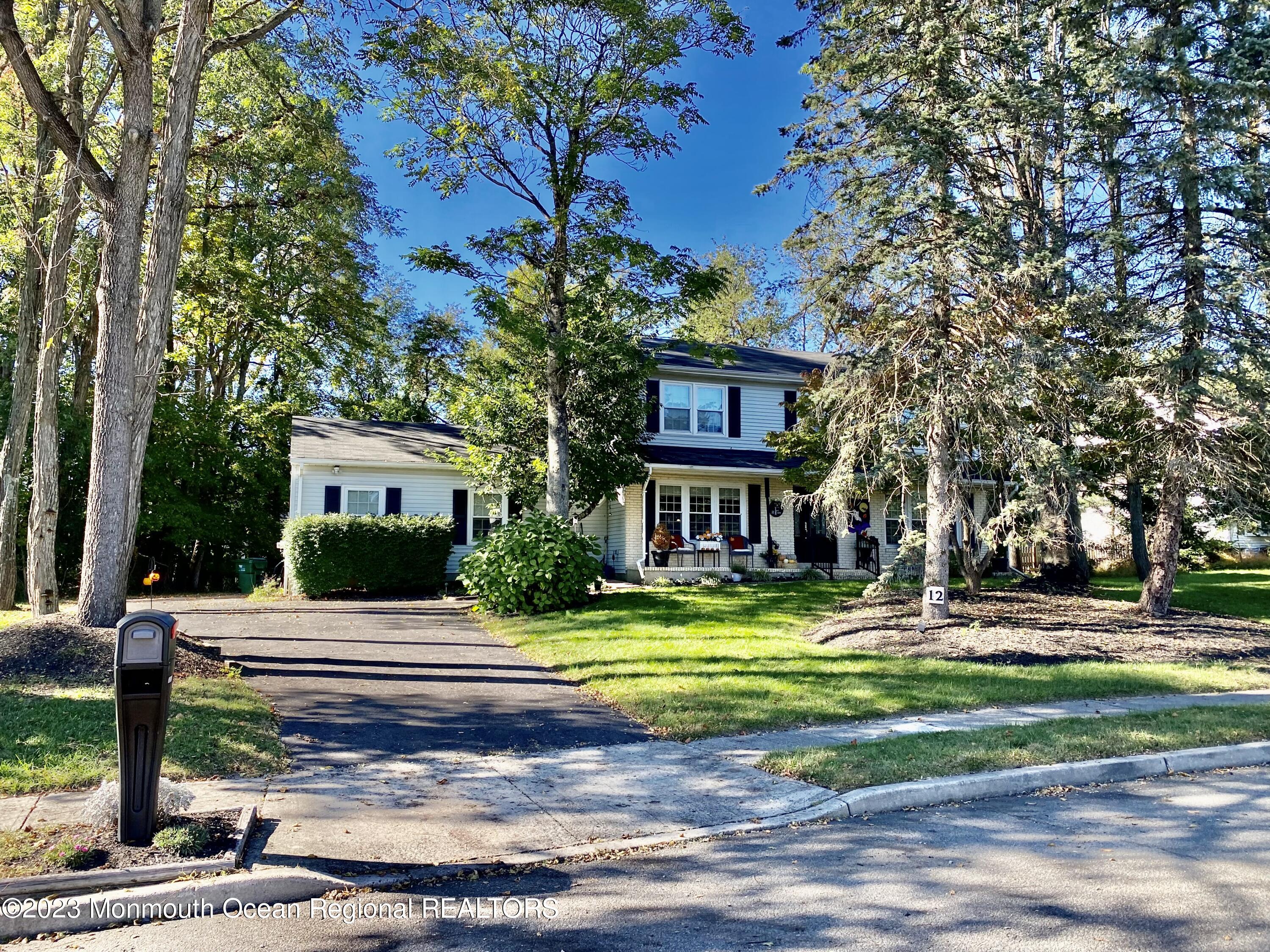 12 Spicy Pond Road Howell, NJ 07731 - Photo 2 of 19 a view of a house with a yard and tree s