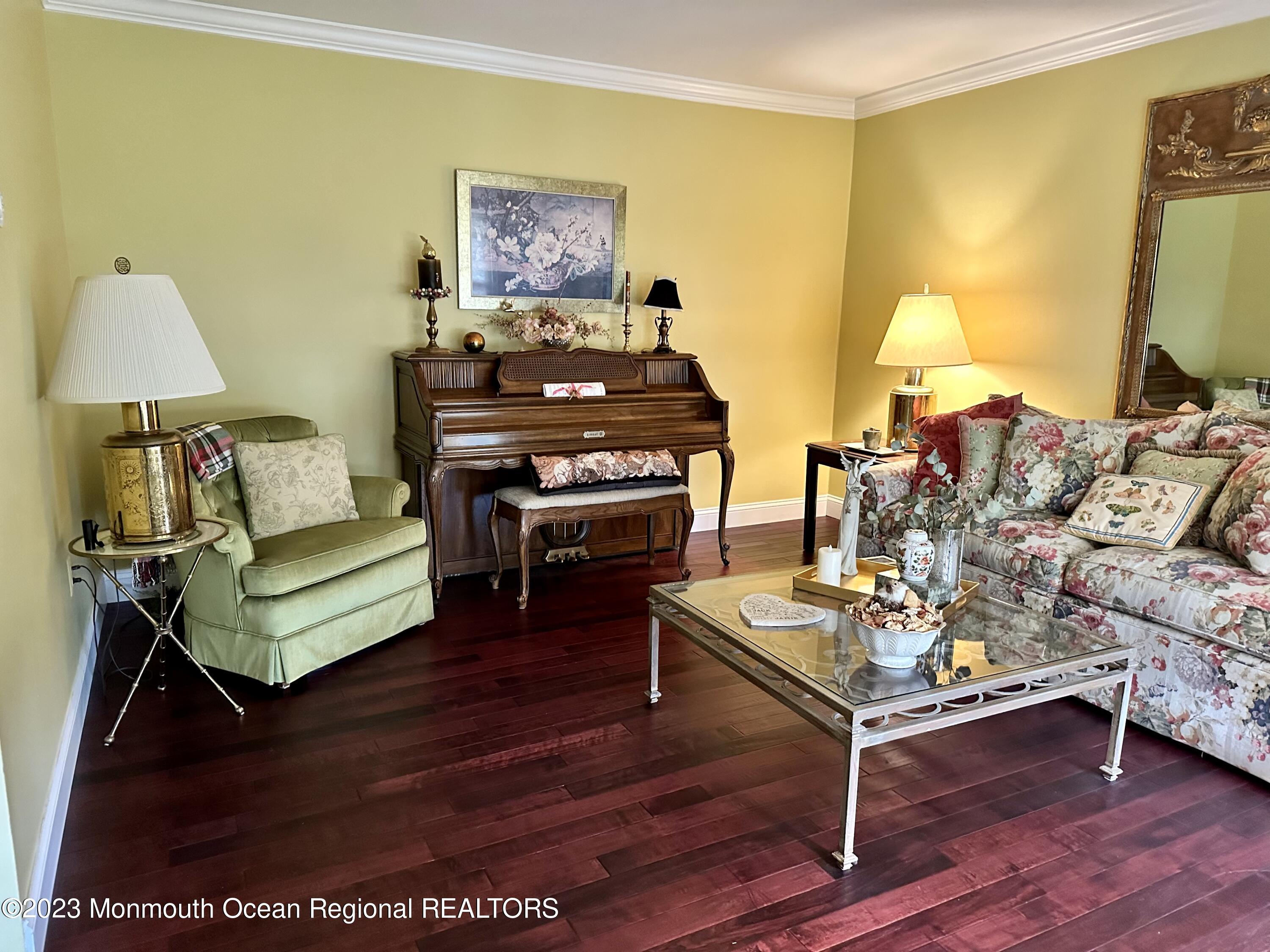 12 Spicy Pond Road Howell, NJ 07731 - Photo 6 of 19 a living room with furniture and a flat screen tv