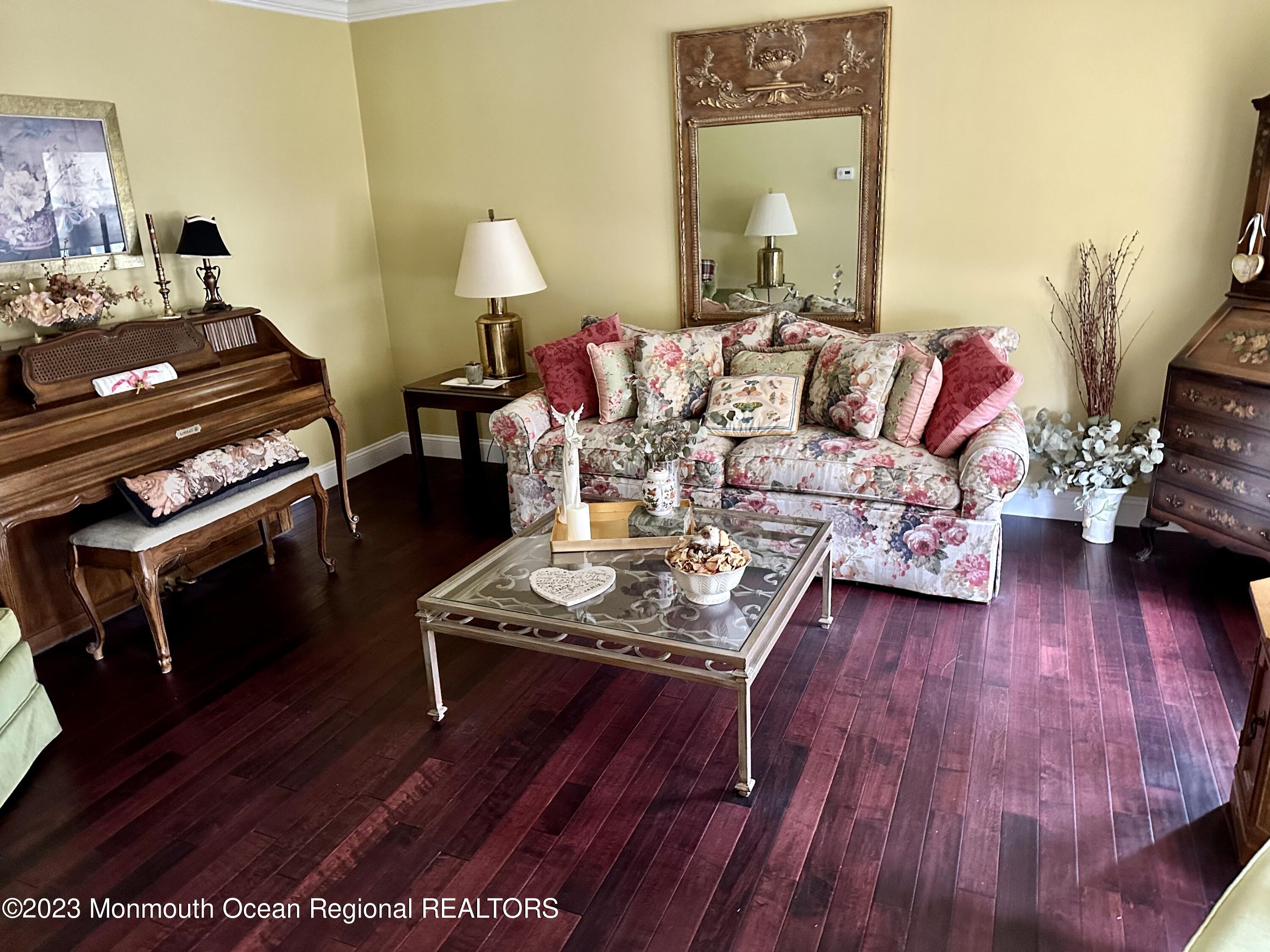 12 Spicy Pond Road Howell, NJ 07731 - Photo 8 of 19 a living room with furniture and wooden floor