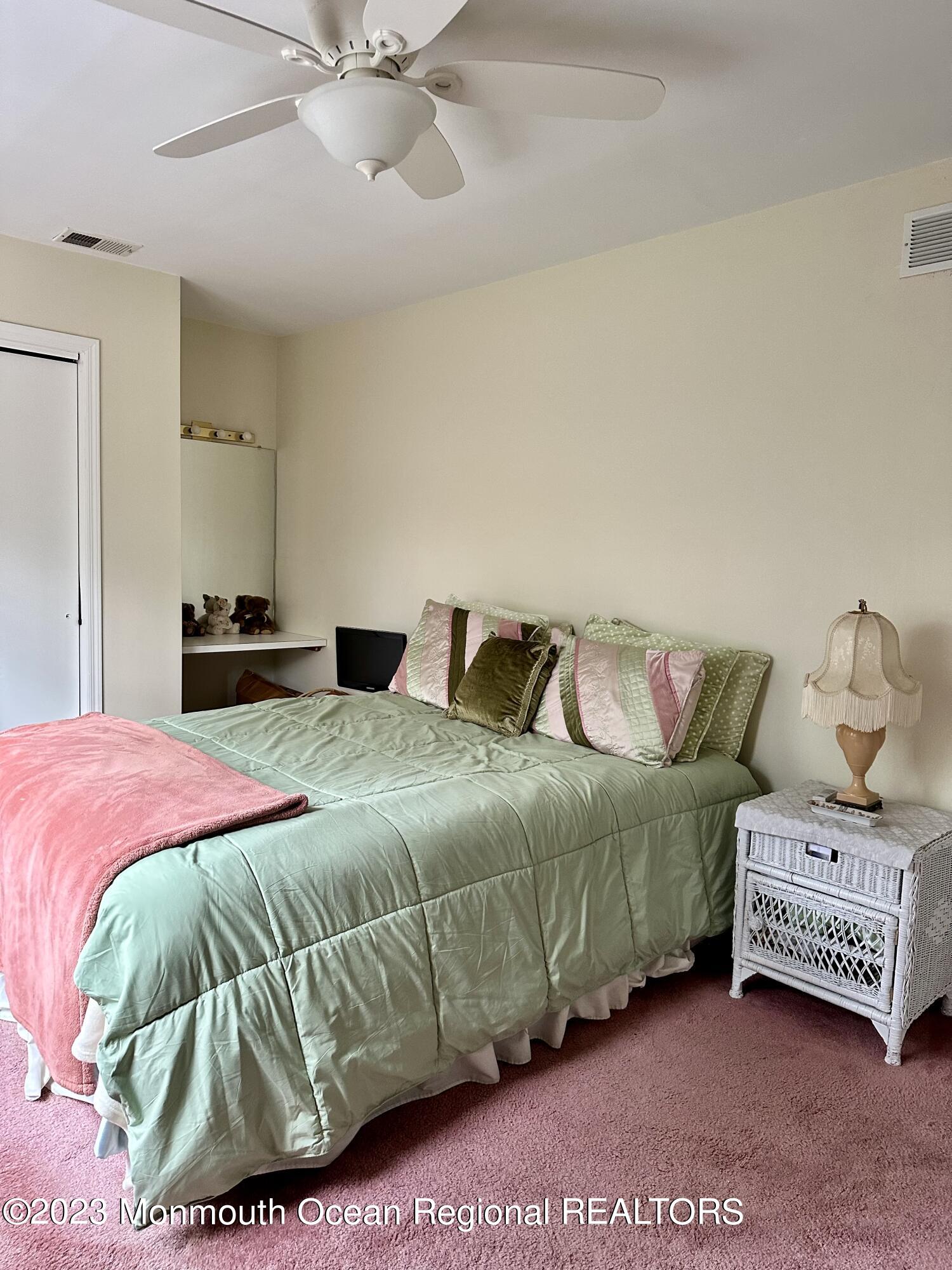 12 Spicy Pond Road Howell, NJ 07731 - Photo 10 of 19 a bedroom with a bed and a couch