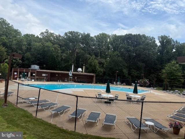 11260 Chestnut Grove Square, Unit 338 Reston, VA 20190 - Photo 16 of 18 a view of a patio with a table and chairs