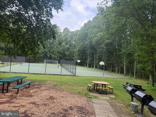 11260 Chestnut Grove Square, Unit 338 Reston, VA 20190 - Photo 18 of 18 a view of a park with swings