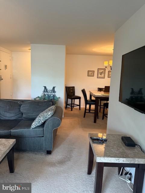 11260 Chestnut Grove Square, Unit 338 Reston, VA 20190 - Photo 7 of 18 a living room with furniture and flat screen tv