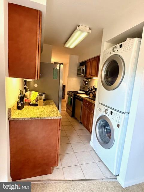 11260 Chestnut Grove Square, Unit 338 Reston, VA 20190 - Photo 8 of 18 a utility room with sink dryer and washer