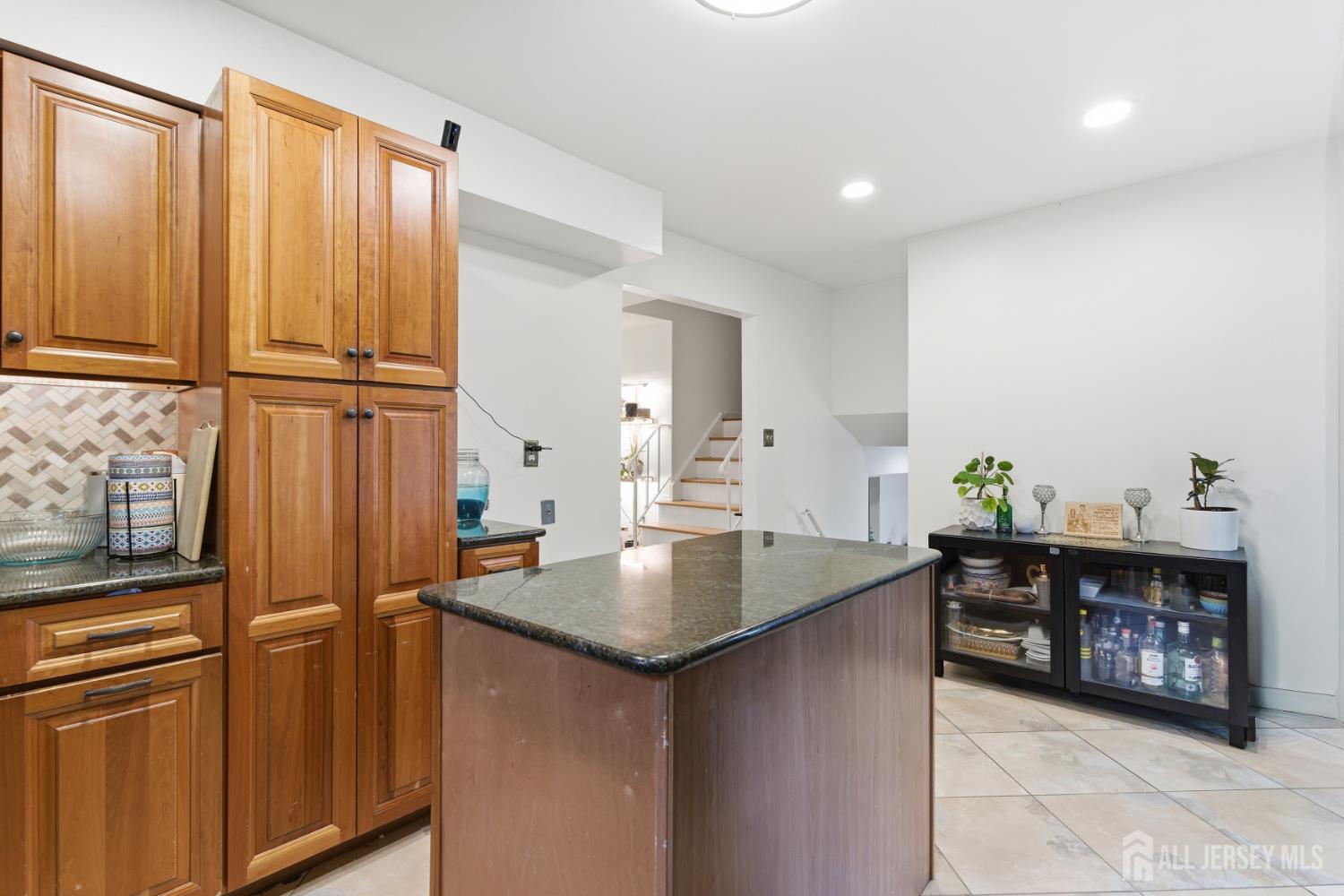 213 Normandy Road Edison, NJ 08820 - Photo 17 of 45 a kitchen with stainless steel appliances granite countertop a refrigerator and a sink