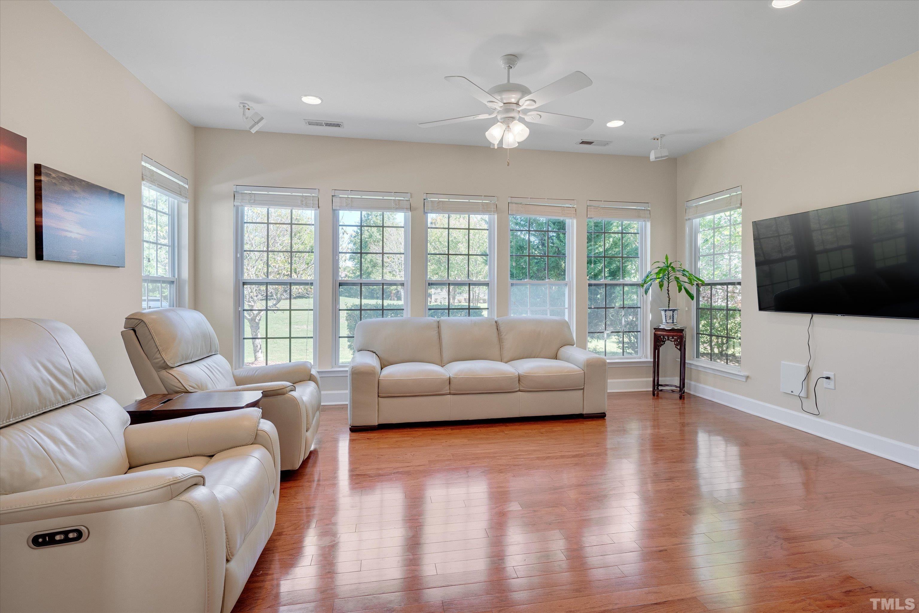 315 Beckingham Loop Cary, NC 27519 - Photo 12 of 34 a living room with furniture and a flat screen tv