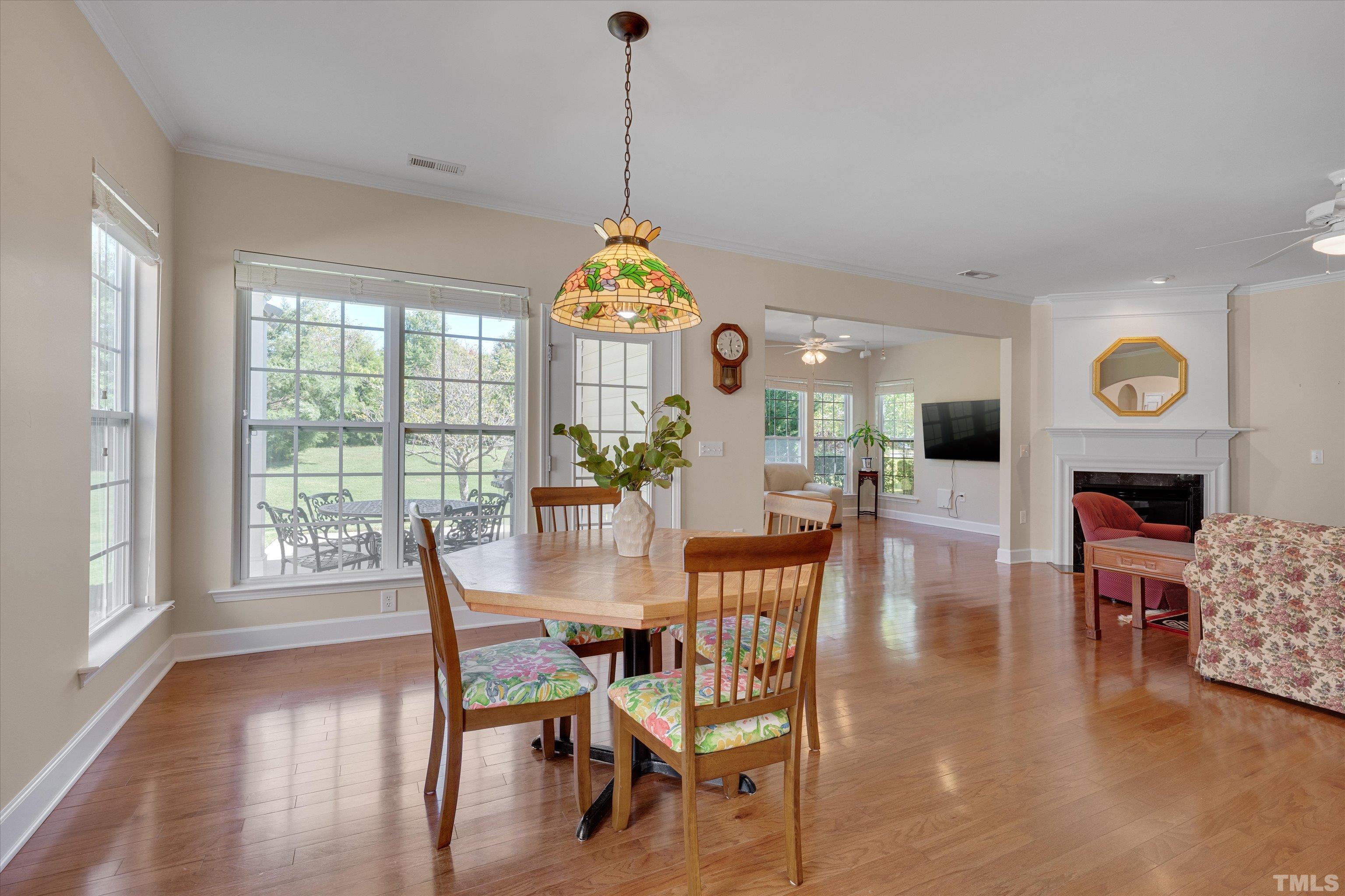 315 Beckingham Loop Cary, NC 27519 - Photo 15 of 34 a view of a dining room with furniture window and wooden floor