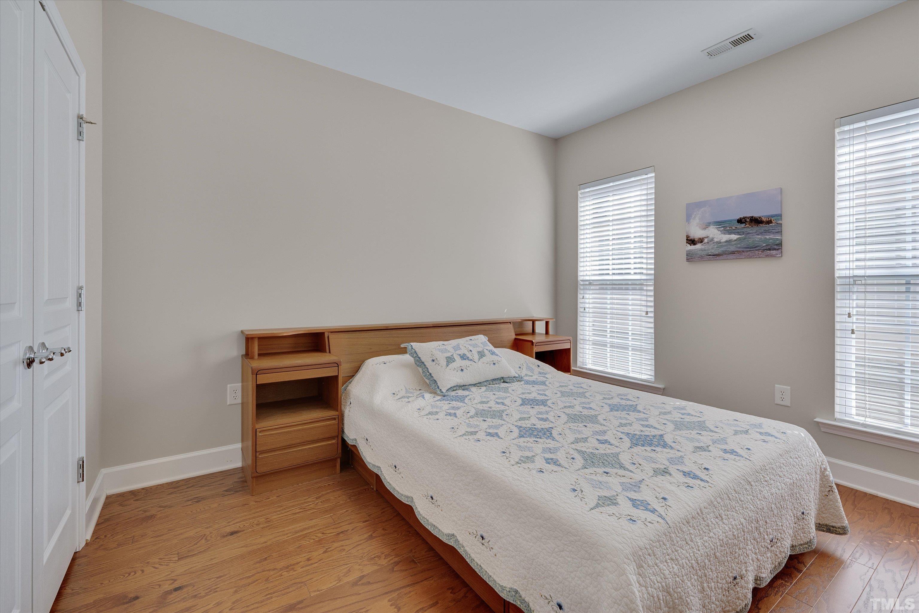 315 Beckingham Loop Cary, NC 27519 - Photo 23 of 34 a bedroom with a bed and a window