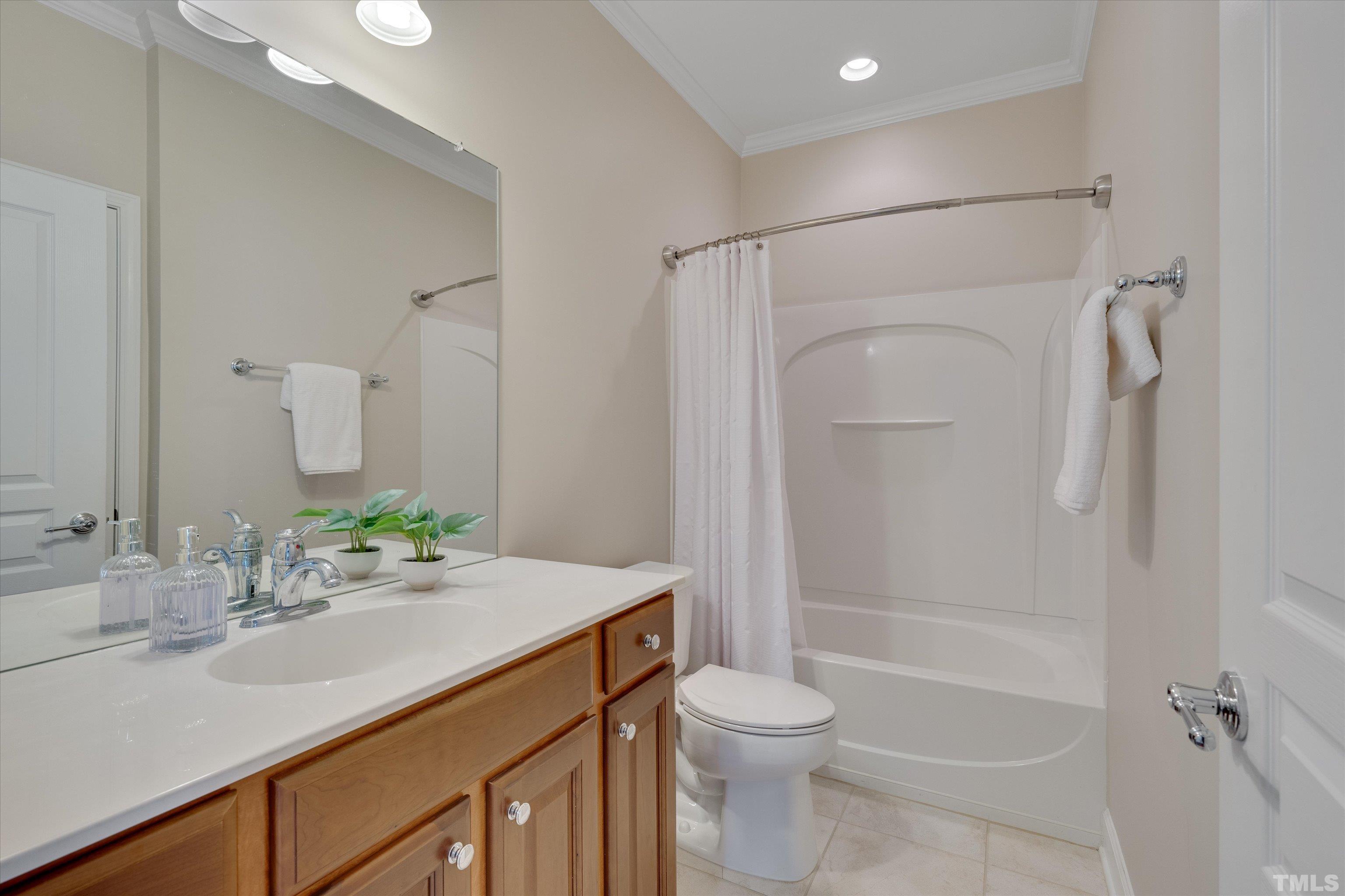 315 Beckingham Loop Cary, NC 27519 - Photo 25 of 34 a bathroom with a sink a toilet and shower