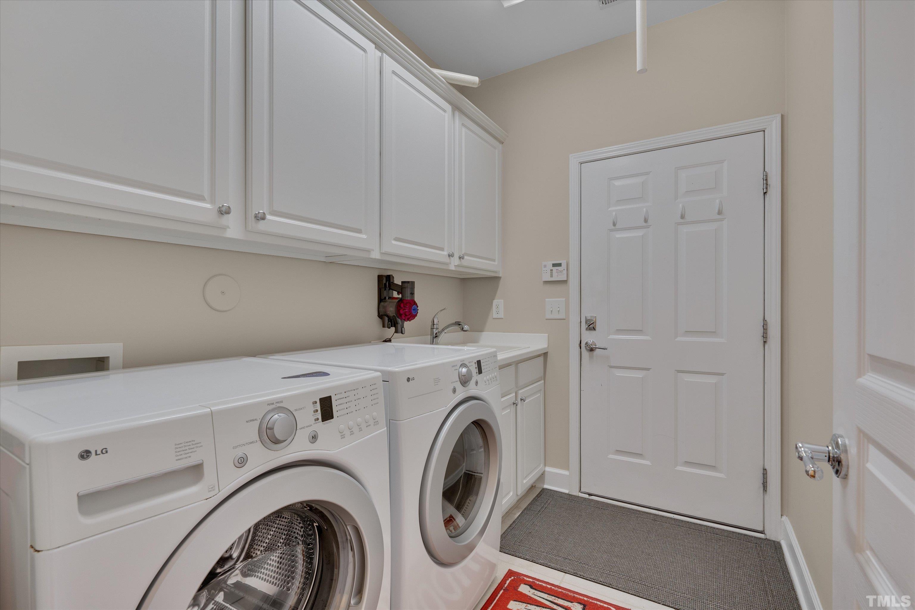 315 Beckingham Loop Cary, NC 27519 - Photo 27 of 34 a utility room with dryer and washer