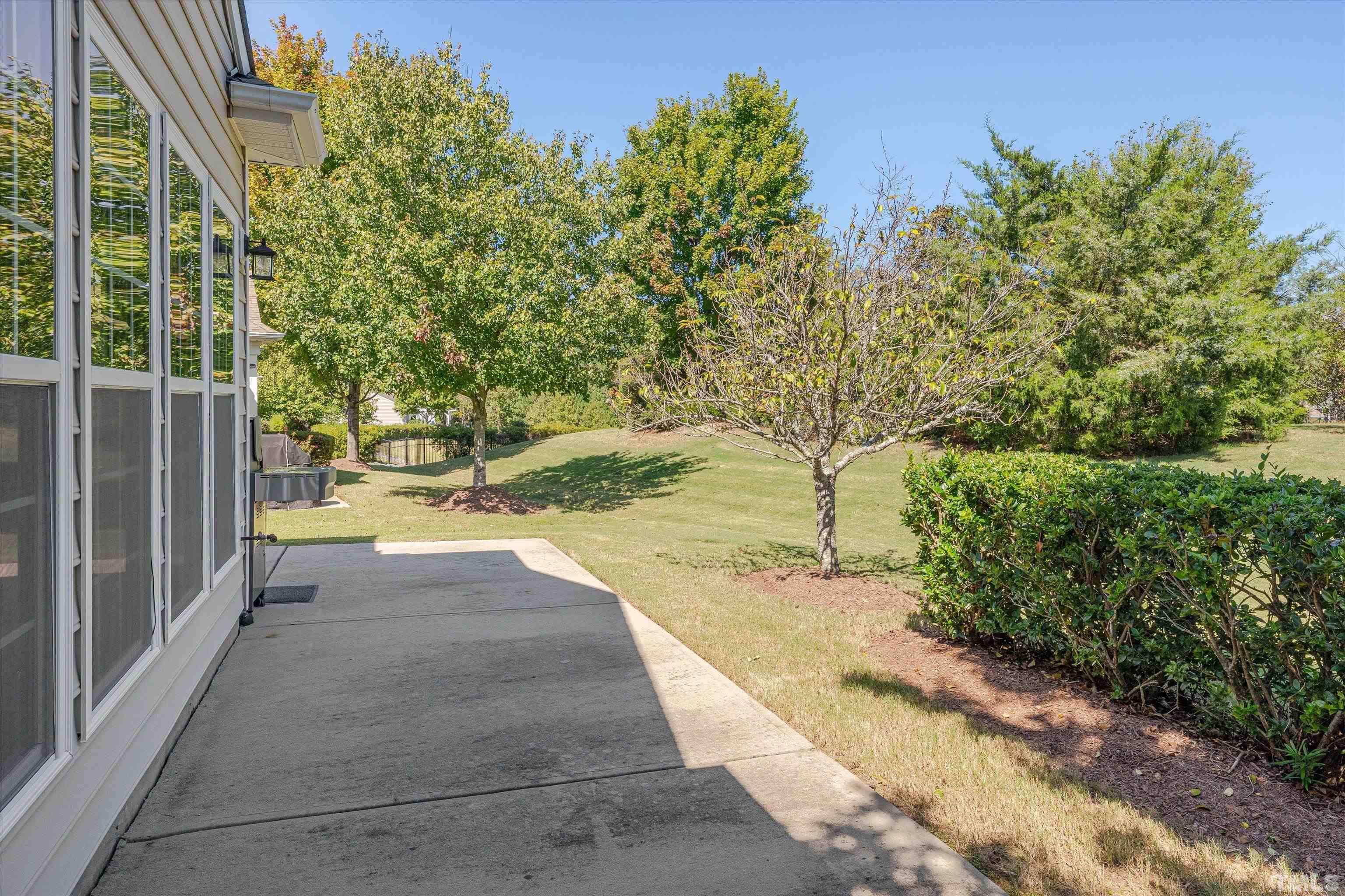 315 Beckingham Loop Cary, NC 27519 - Photo 29 of 34 a view of a yard with plants and large trees